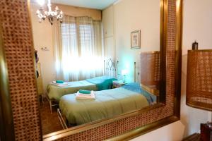 A bed or beds in a room at Affittacamere Umberto&Marisa