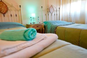 A bed or beds in a room at Affittacamere Umberto&Marisa