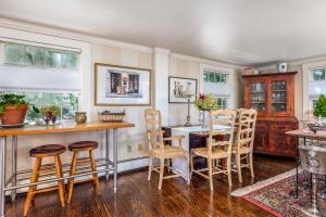 a dining room with a table and chairs at SeaCity View in Swampscott