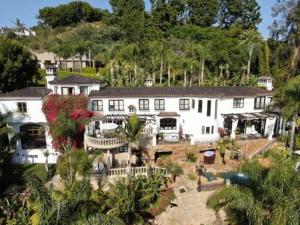 an aerial view of a large white house at Bel Air Luxury Villa in Los Angeles