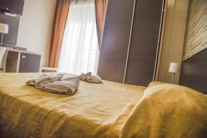 Lova arba lovos apgyvendinimo įstaigoje Hotel Massimo Resort