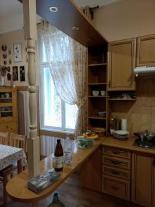 a kitchen with a table and a window in it at Dream appartment for a nice holiday with a bedroom and living room! in Mariánské Lázně
