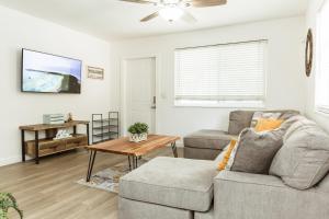 a living room with a couch and a table at Florida style House 10 min from the beach in Hallandale Beach