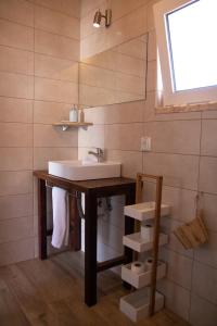 a bathroom with a sink and a mirror at Casa Boa Onda in Sagres