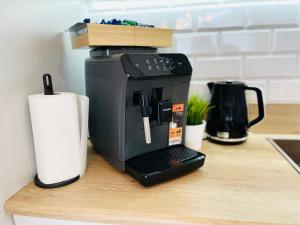 a coffee maker sitting on top of a counter at Golden Tobaco in Łódź