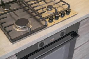 a stove top oven sitting on top of a counter at RentWill apartments Sixteen in Chişinău +16 photos