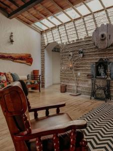 a living room with a couch and a fireplace at Casa Amada in Arraial d'Ajuda
