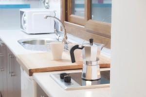 A kitchen or kitchenette at Apartamentos Catedral Plaza 3000 Még 36 kép