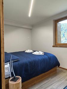 Postel nebo postele na pokoji v ubytování Abete Rosso, appartamento vicino alle piste da sci