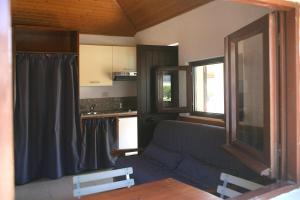 a living room with a couch and a table at IRON GATE MARINA3B in Sarzana