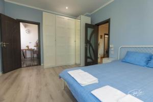 A bed or beds in a room at La Corte dei Bohem