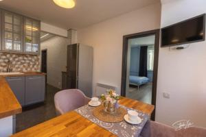 A kitchen or kitchenette at La Corte dei Bohem