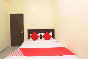 Postel nebo postele na pokoji v ubytování Hotel O Manoj + 26 fotografií