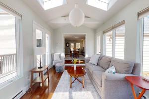 a living room with a couch and a table at White Oaks in Branford