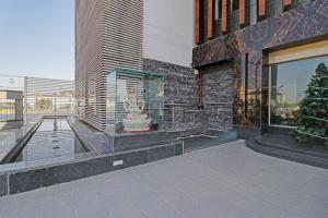 a building with a statue on the side of it at Collection O Hotel Moon in Jammu