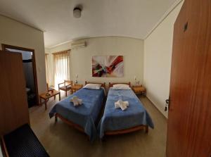 Postel nebo postele na pokoji v ubytování Polemarhos Guest House 8