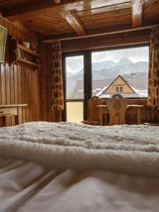 Posteľ alebo postele v izbe v ubytovaní Z Giewontem w Tle Apart&Room