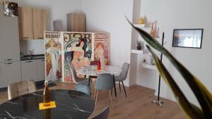 a kitchen with a table and chairs in a room at Massimo Luxury Rooms in Palermo