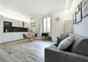 a living room with a couch and a table at Casa Vacanza Milano in Milan