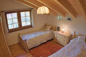 Postel nebo postele na pokoji v ubytování Zermattmountainchalet Tambiel