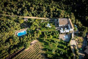 an aerial view of a house with a swimming pool at Finca Bell-Lloc in Palamós