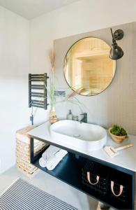 a bathroom with a sink and a mirror at Apartament Czerwona Łasica in Jaworki +8 photos