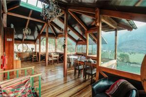 a dining room with a view of a mountain at Hostal Chikiyan in San José de Maipo