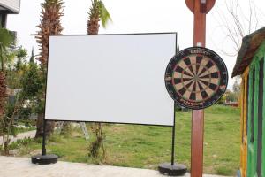 a dart board on a pole with a sign at Side Alya Hotel in Side