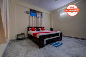 a bedroom with a bed with a sign that says no remembered at Flagship Rajbanshi Nagar in Patna