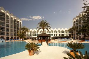 a view of the courtyard of a resort with a swimming pool at Ona Marinas de Nerja Spa Resort in Nerja