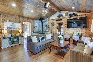 a living room with a couch and a table at Idyllic Wishon Vacation Rental about 9 Mi to Bass Lake in Bass Lake Annex