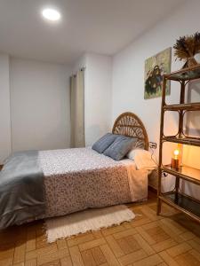 a bedroom with a bed and a ladder at LA COLMENA in Cañizares