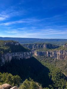a view of the blue mountains from the top of a mountain at LA COLMENA in Cañizares