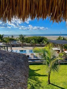 a view of a resort with a palm tree at LaVentana Tatajuba in Tatajuba