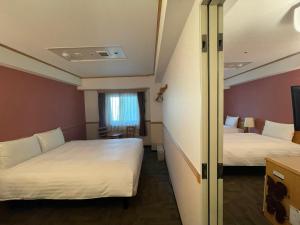 Postel nebo postele na pokoji v ubytování Toyoko Inn Busan Seomyeon