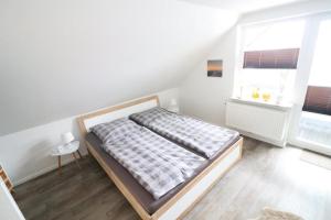 Katil atau katil-katil dalam bilik di Appartementhaus-Kogge-Wohnung-7