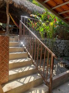 a set of stairs leading up to a house at Casa Hotel Familiar 