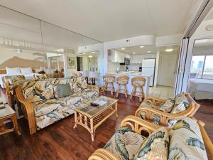 a living room with a couch and a table at Ilikai Tower 633 Yacht Harbor View 1BR in Honolulu