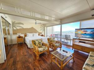 a hotel room with a bed and a tv at Ilikai Tower 633 Yacht Harbor View 1BR in Honolulu