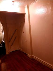 an empty room with a hallway with a door at Spacious rental in brooklyn in Brooklyn
