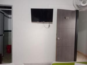 TV a/nebo společenská místnost v ubytování Hotel El Deportista