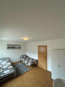 a room with two bunk beds and a door at 1 Zimmer für 2 Personen Bruchsal in Bruchsal