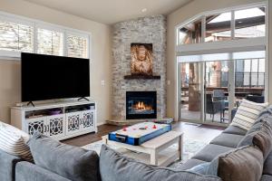 a living room with a couch and a fireplace at HomeAway Vacation Rental - Eagle Crest in Redmond