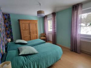 Posteľ alebo postele v izbe v ubytovaní Maison spacieuse avec terrasse, près de Saint-Dié, idéale pour randonnées et proche de l'Alsace - FR-1-589-464