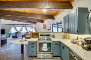 a kitchen with blue cabinets and a counter top at Wisconsin Vacation Rental 1 Mi to Road America! in Plymouth