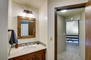a bathroom with a sink and a mirror at Wisconsin Vacation Rental 1 Mi to Road America! in Plymouth +35 photos