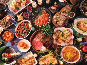 a table topped with lots of different dishes of food at Tokyo Bay Tokyu Hotel in Urayasu