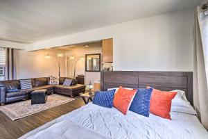 a bedroom with a bed with colorful pillows on it at Newport Beach Vacation Rental - Short Walk to Pier in Newport Beach
