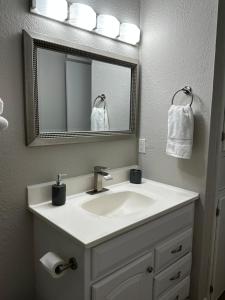 a bathroom with a sink and a mirror at Eagle Stay in Eagle Pass
