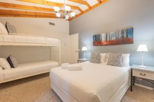 a bedroom with two bunk beds and a couch at Hunter Gleann Pty Ltd in Pokolbin +67 photos